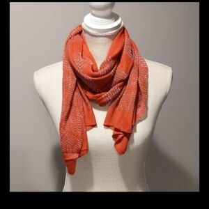 Scarf  L 76 in. 18 in. wide orange w/silver stripes. Worn many ways